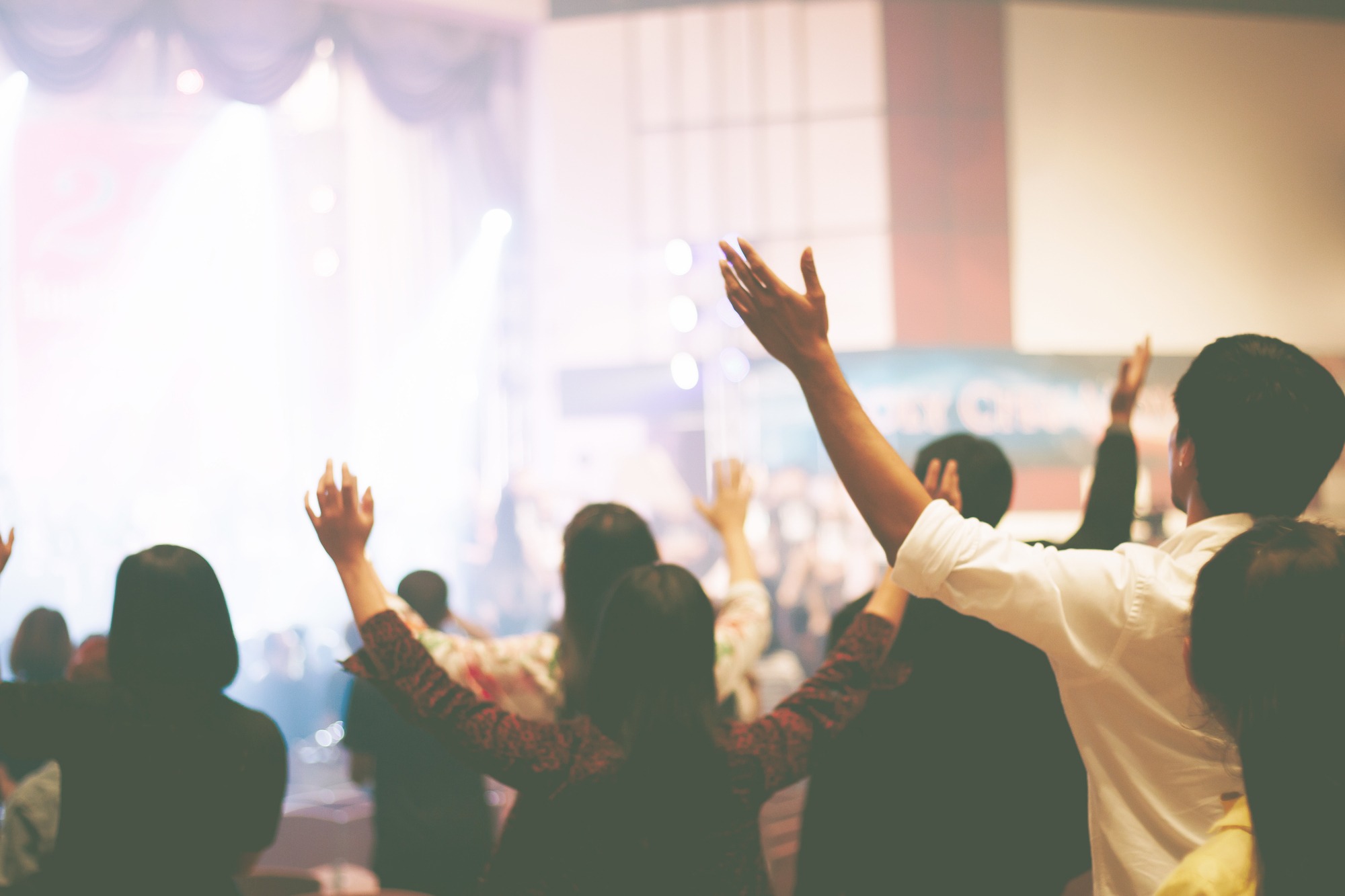 Christian worship with raised hand,